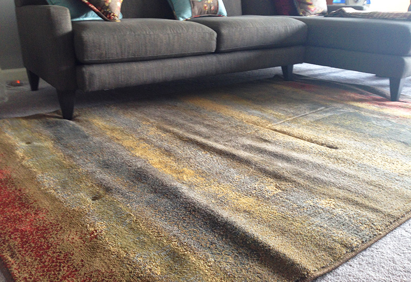 How to keep an area rug from creeping on a carpeted floor - The